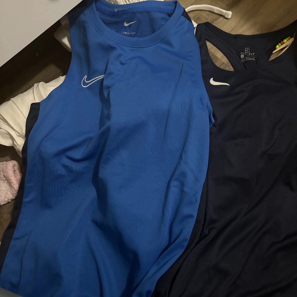 Two Nike tank tops
